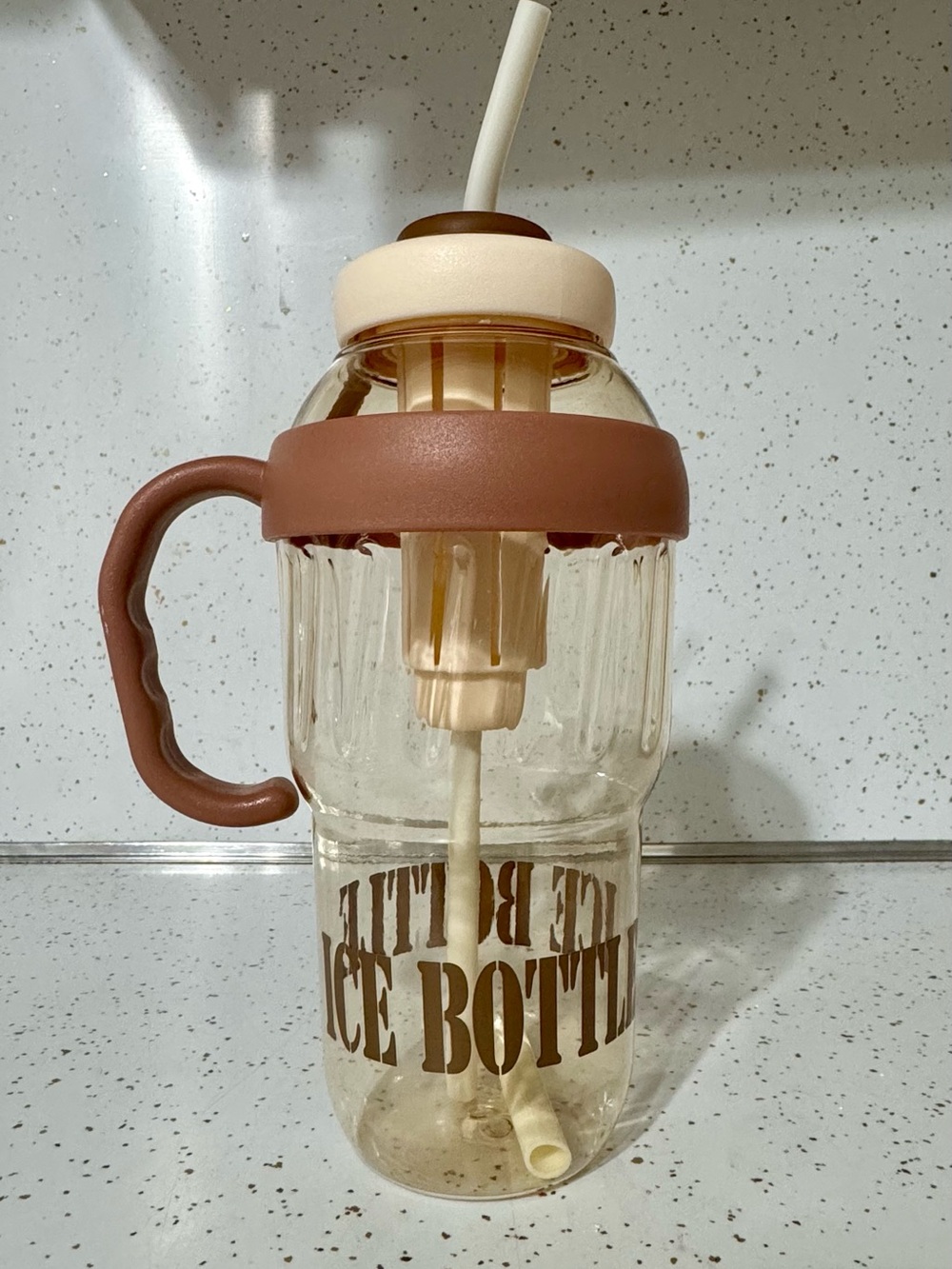 Ice Bottle Beverage Cup with Brown Handle and Cream Lid